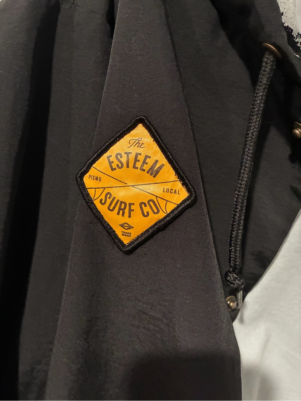 Men's Black Windbreaker with Yellow Diamond Patch